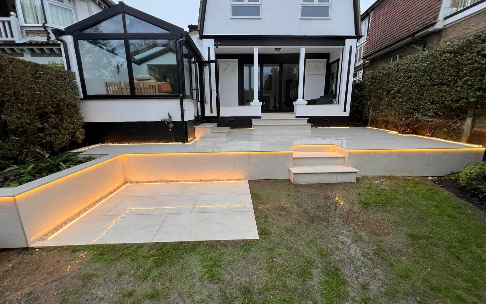 The finished porcelain patio with steps by Hills Driveways & Patios